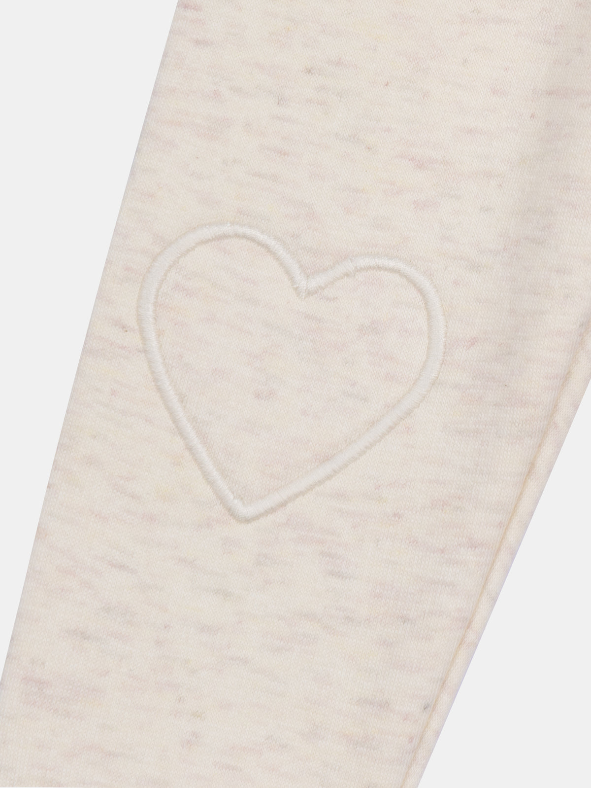 Pantaloni ecru con toppe a forma di cuore sulle ginocchia per bambina