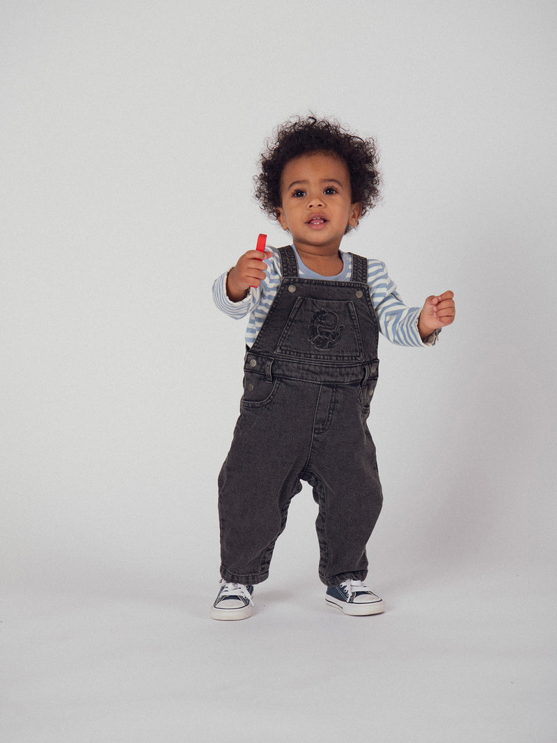 Salopette in denim grigia "Dinosauro" per bambino