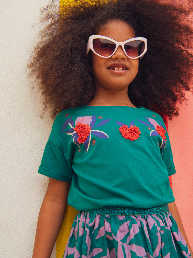 T-shirt verde con animazione floreale per ragazze