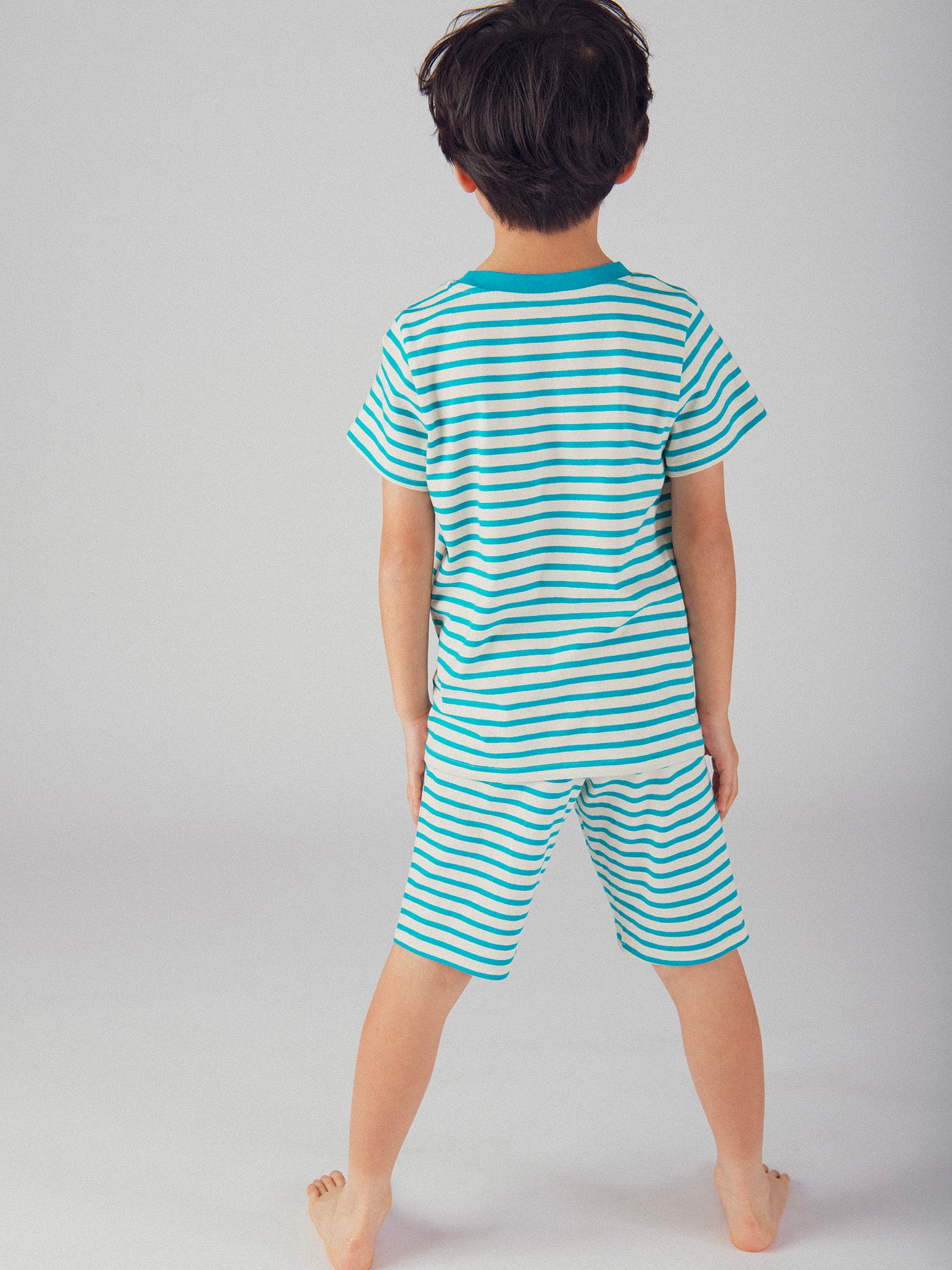 Pigiama corto fosforescente a righe con motivo "Mostro Divertente" per bambino