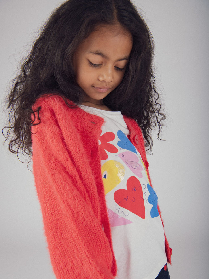 Cardigan rosso con bottoni a cuore per bambina