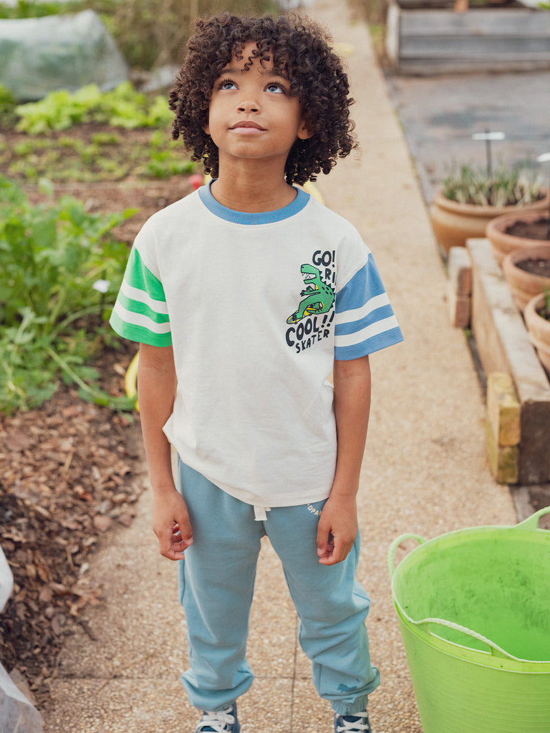 T-shirt color ecru con animazione di dinosauri per ragazzi