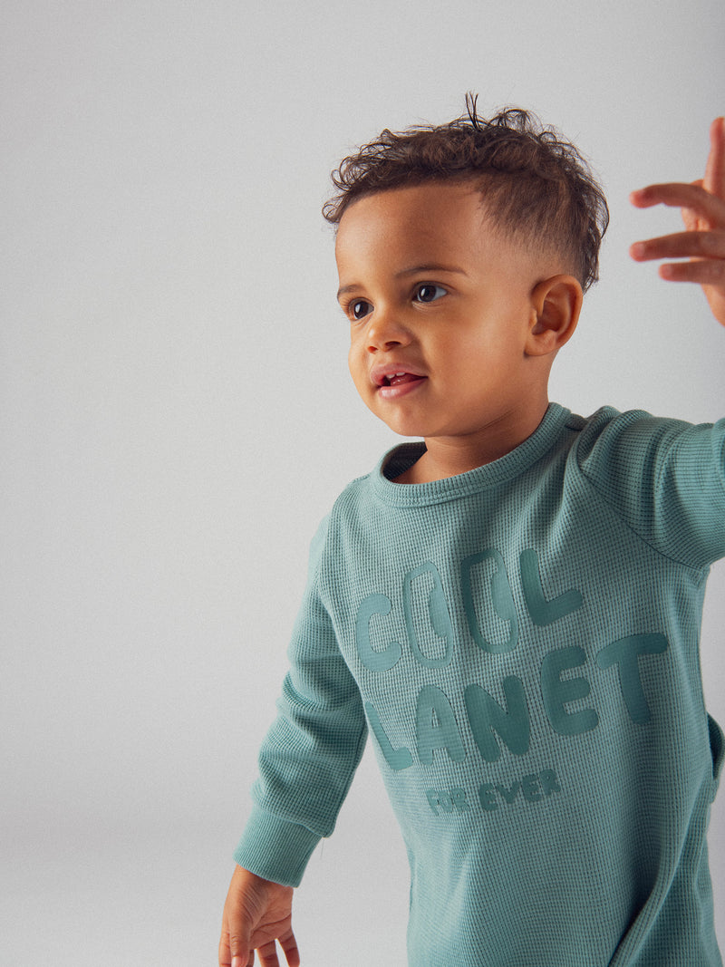 Pigiama verde "Good Vibes" in maglia goffrata per bambino