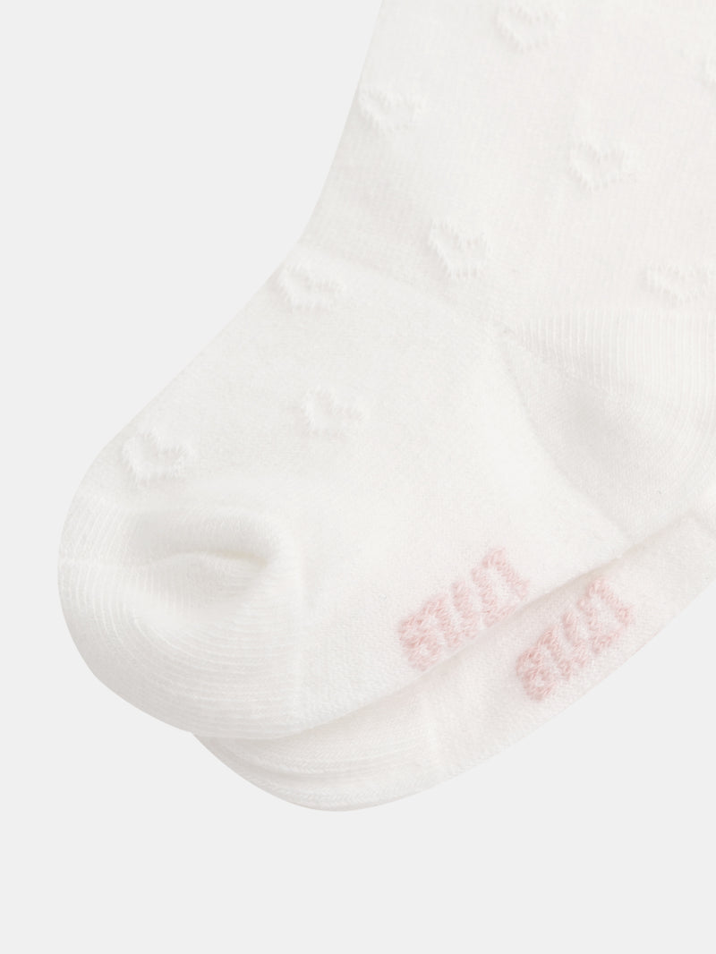 Collant ecru con cuori intagliati per bambine