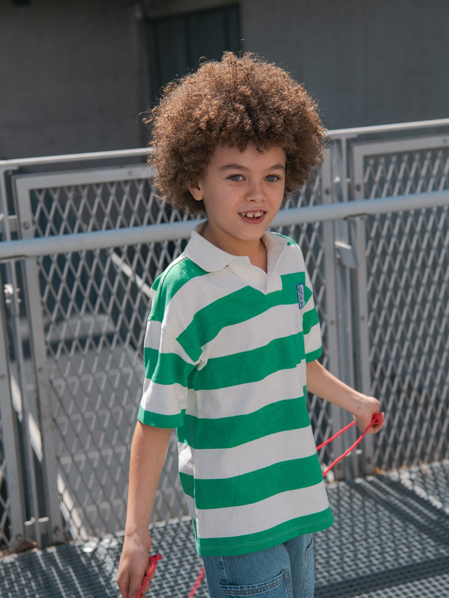 T-shirt polo ecru a righe verdi per bambino
