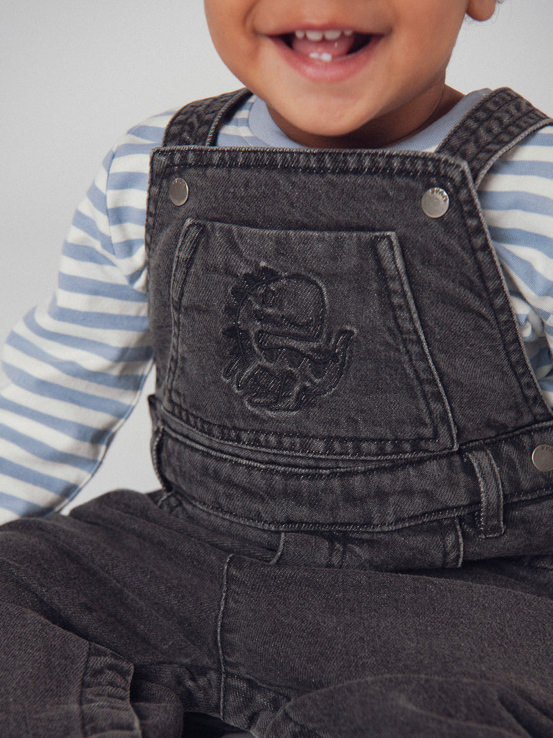 Salopette in denim grigia "Dinosauro" per bambino