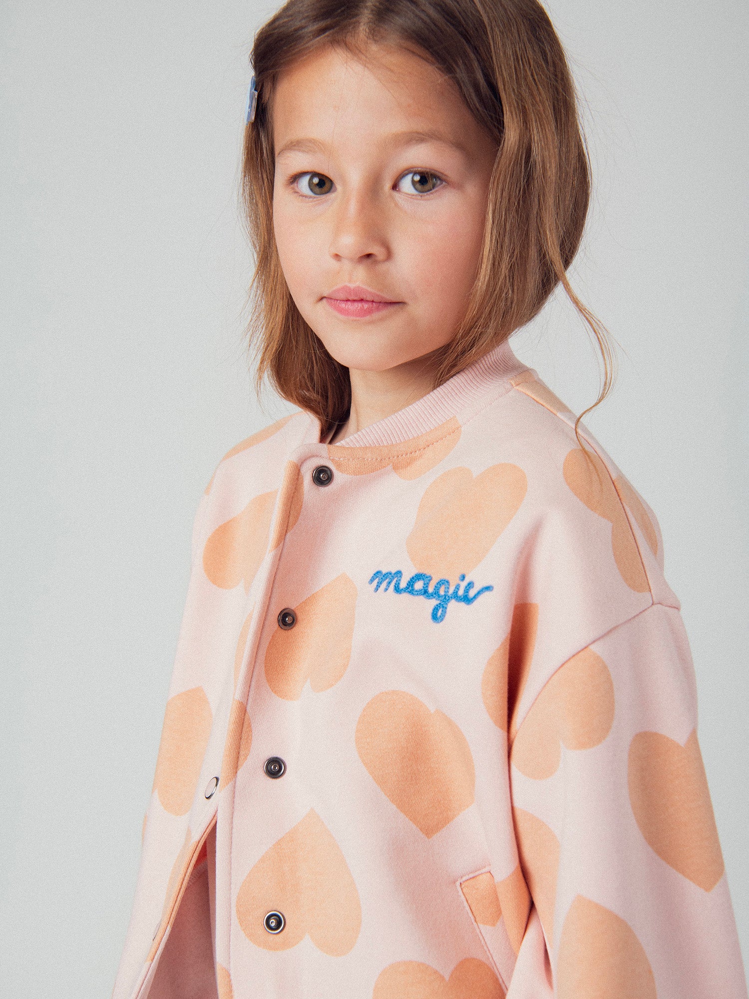 Cardigan rosa con stampa a cuore per bambine
