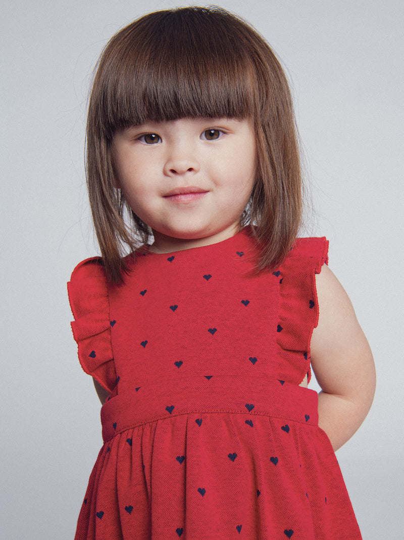 Abito rosso in maglia con stampa cuori per bambina