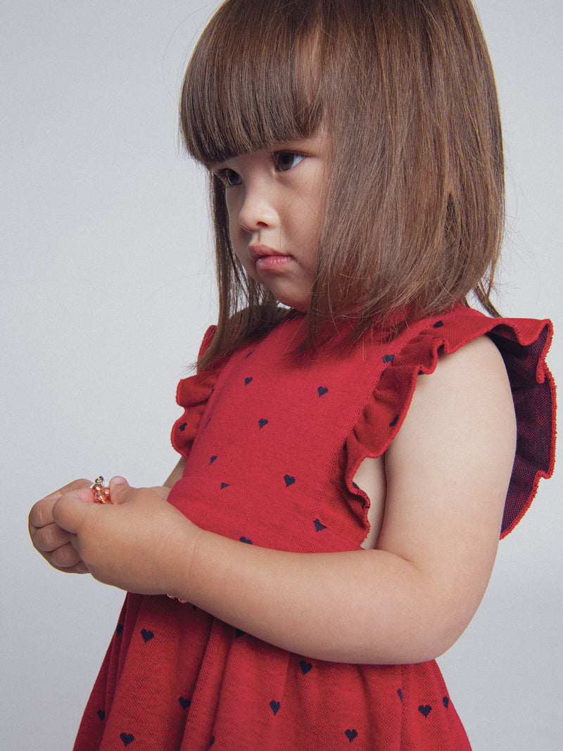 Abito rosso in maglia con stampa cuori per bambina