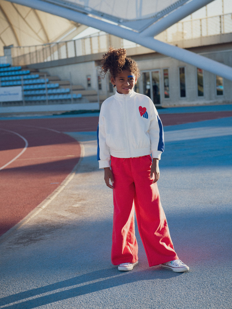 Pantaloni rossi in felpa con strisce colorate per ragazze