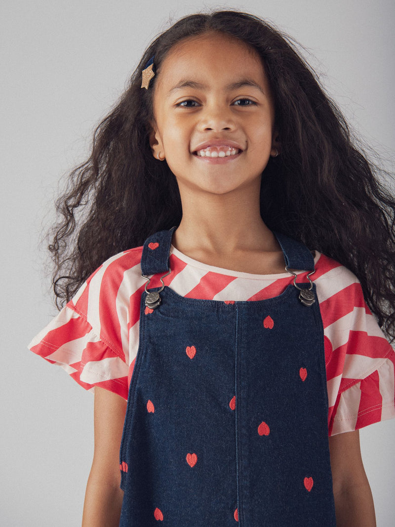 Abito-salopette blu in denim con ricami a cuore per ragazze