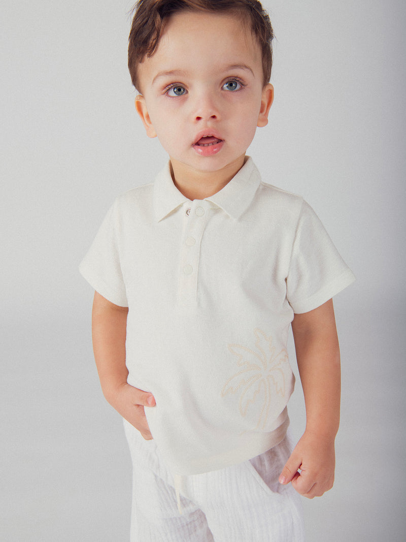 Polo ecru con ricamo di palma per bambino