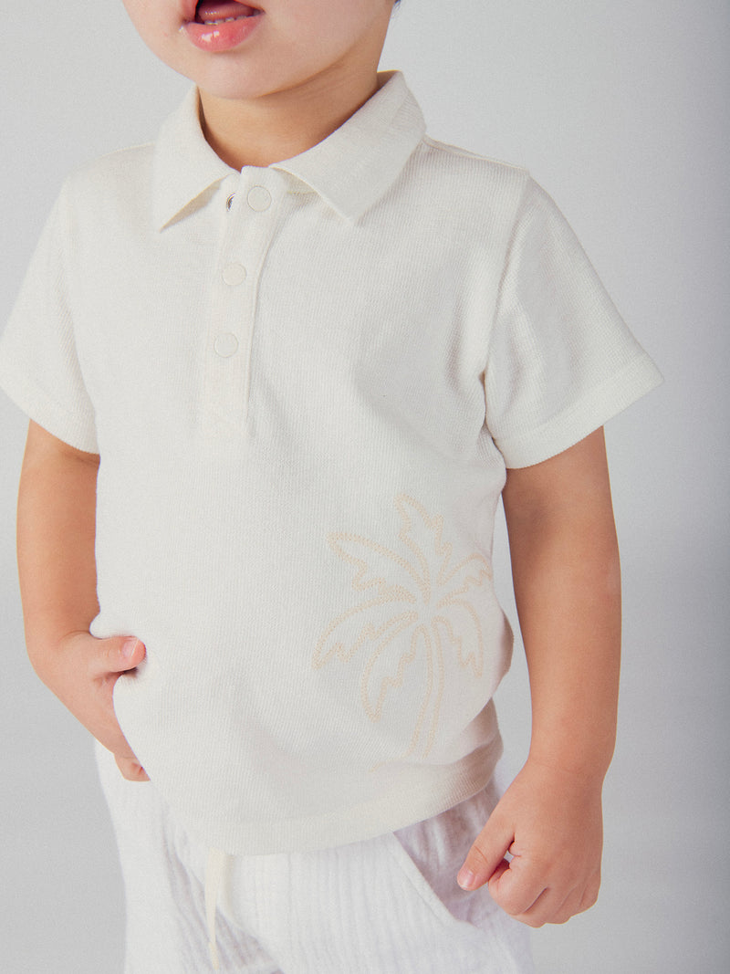 Polo ecru con ricamo di palma per bambino