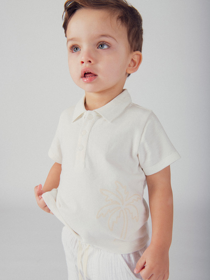 Polo ecru con ricamo di palma per bambino
