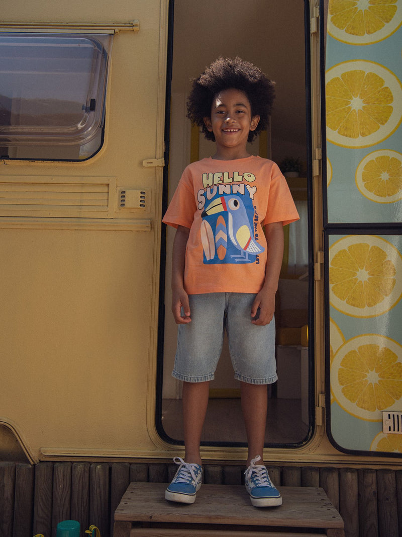T-shirt arancione con animazione tucano per ragazzi