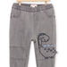 Jeans tinta unita con motivo dinosauro