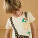 T-shirt crema con motivo giraffa