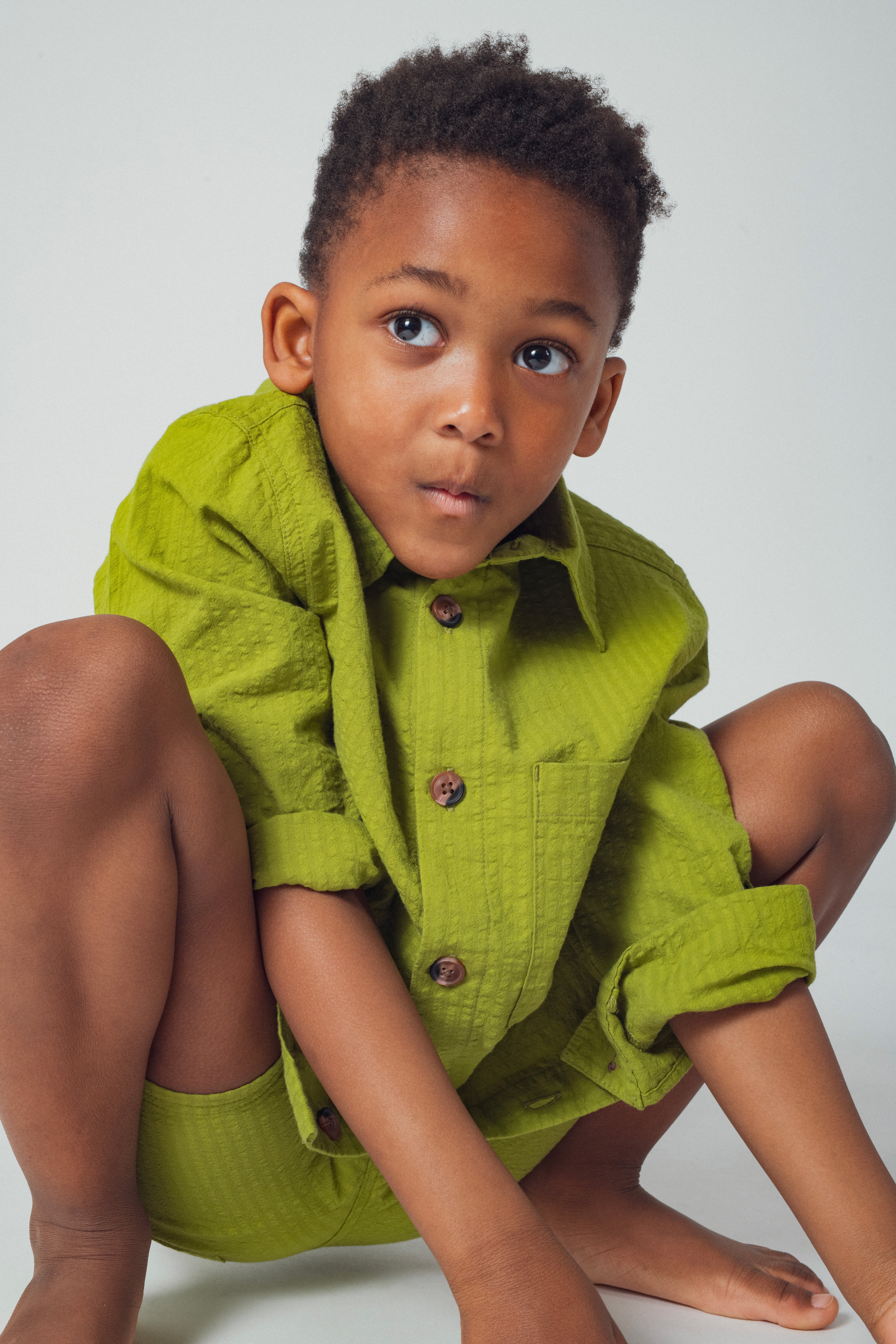 Camicia over verde goffrata